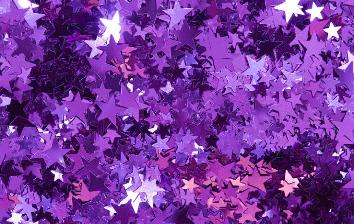 a bright colorful background of sparkling reflective stars