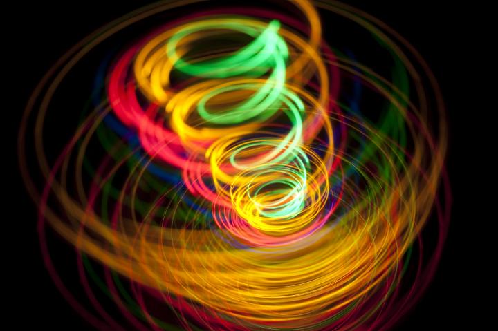 a vivid colored image of lines of spiralling light