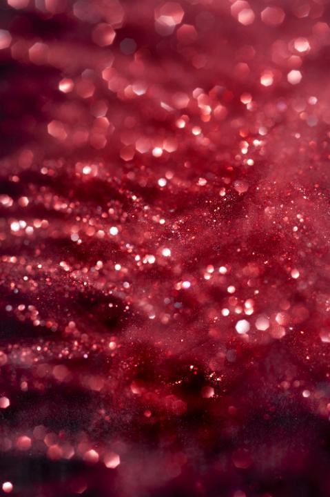 a sparkly red glitter backdrop