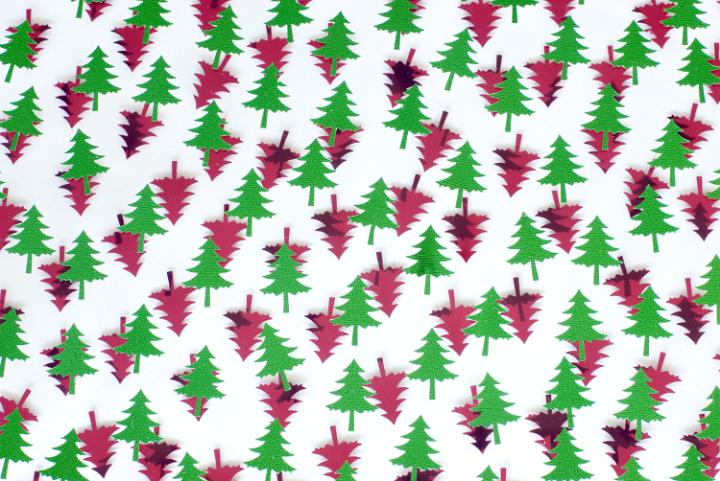a festive themed background of red and green christmas pine tree shapes