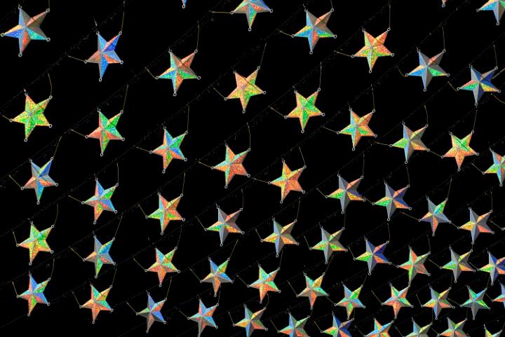 Christmas star array arranged in angled lines on a black background