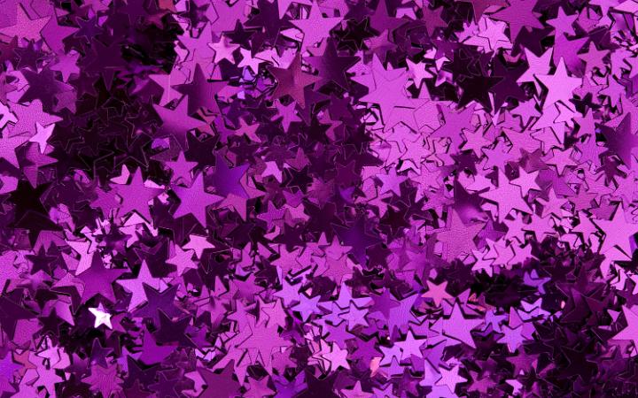 a colorful background of random pink star shapes