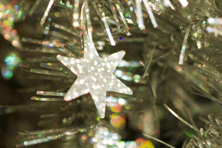 a festive sparkling background of tinsel with decorative star shape