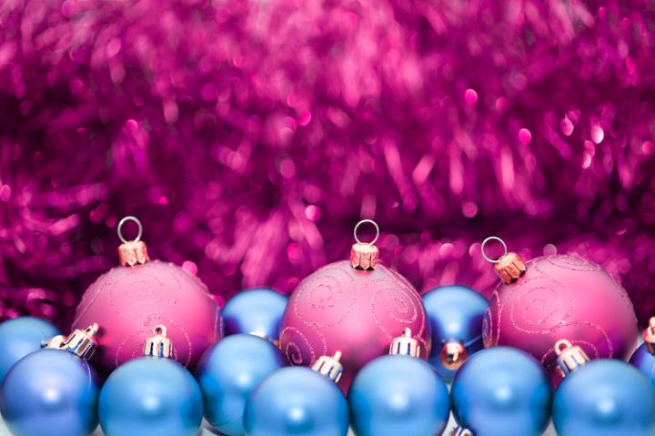 purple and blue baubles with an out of focus sparkling tinsel background