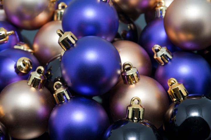 a pile of purple old and black christmas baubles