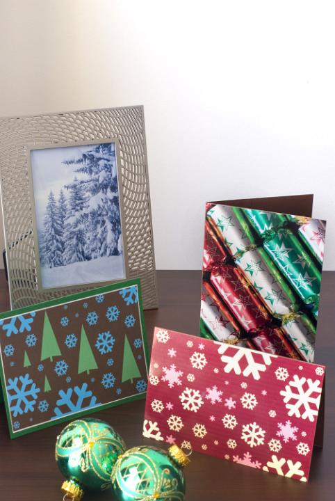 a festive still life image of a winter photo in a frame, christmas cards and ornaments