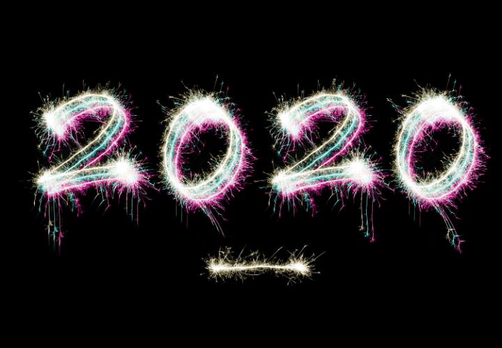 New Years 2020 digits drawn with bright sparkling lights and underlined, isolated on black background