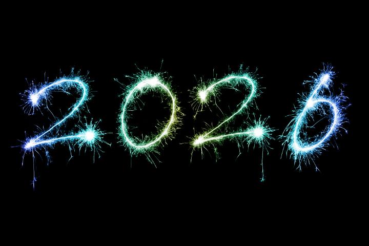 2026 colorful sparkling festive New Year sparkler background over black with copy space for your holiday message