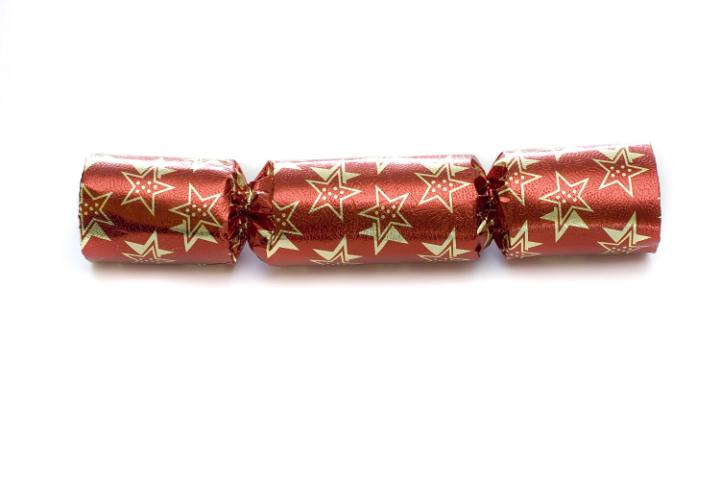 A single red christmas cracker isolated on a white background
