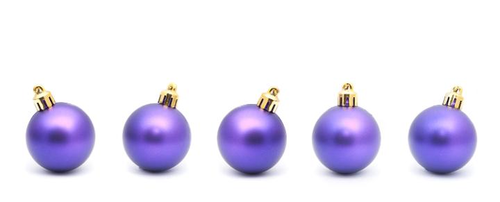 Purple Christmas bauble border with a row of five balls with natural shadow on a white background