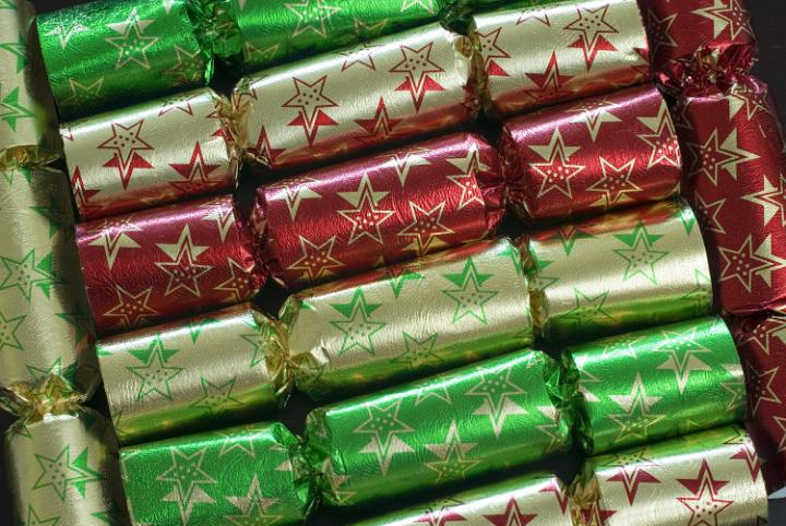 a background image of christmas crackers arranged at different angles