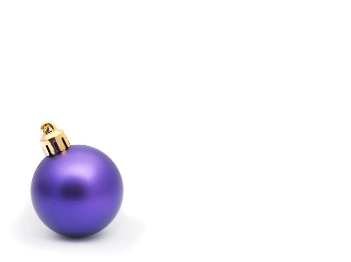 Single purple Christmas bauble to the bottom left of the frame with huge white copyspace for your Christmas message