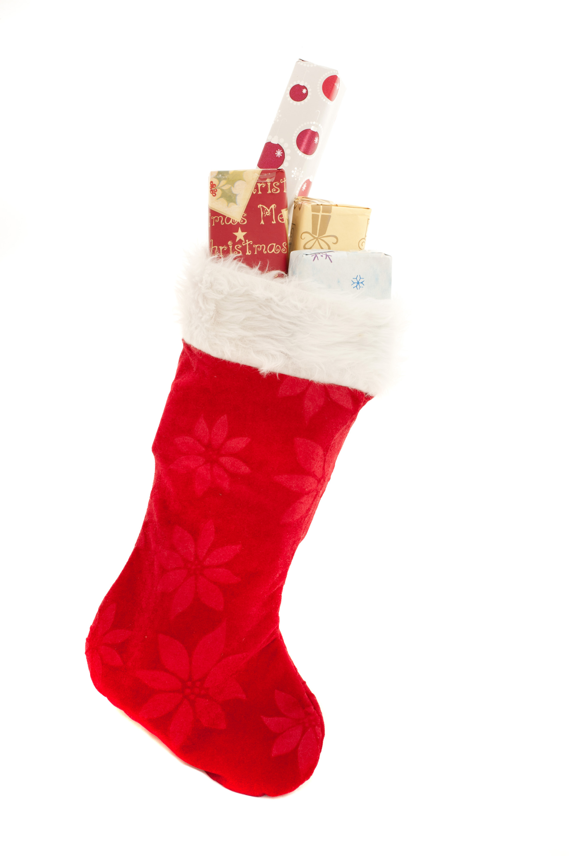 Photo of Isolated red Christmas stocking with gifts | Free christmas images
