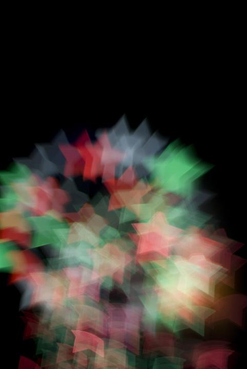 colourful firework bokeh patterns of red green and blue star shapes