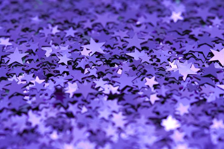 a colorful background of sparkling purple stars