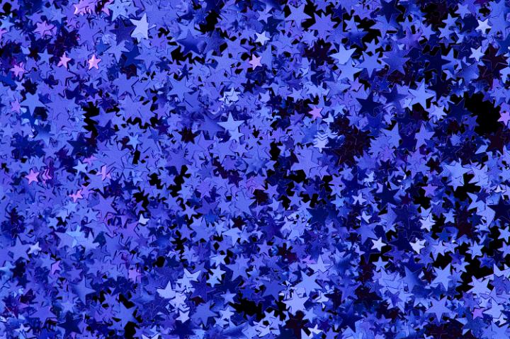 a colorful background of blue and purple star shapes