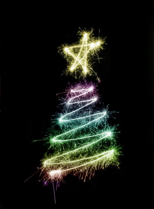 A colorful christmas tree symbol drawn with sparkler trails