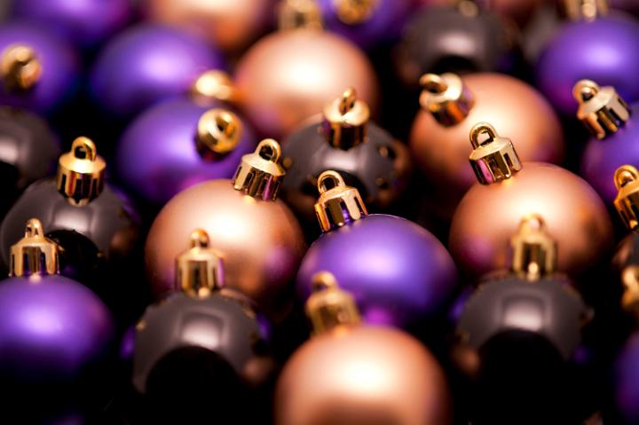 Christmas bauble background with densely packed balls of different colours and shallow dof