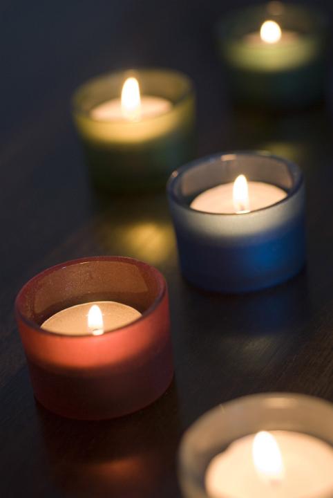 Five different coloured tea light candles