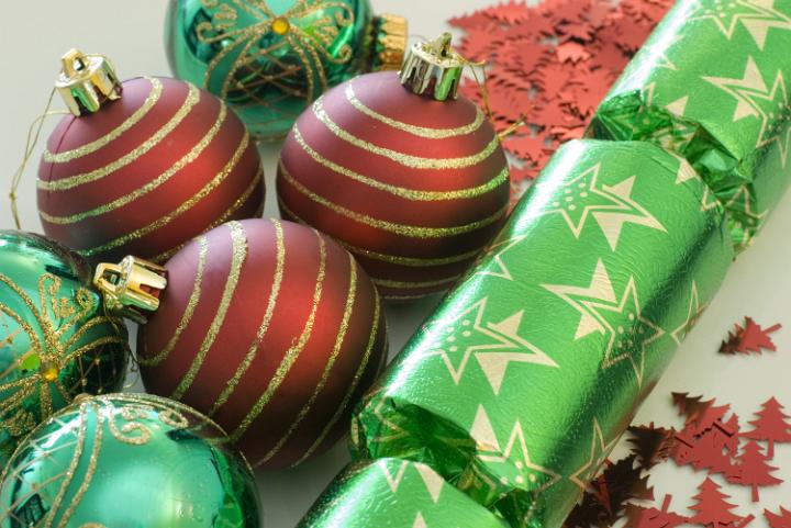 an assortment of red and green coloured christmas decorations