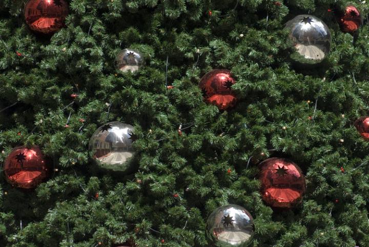 An artificial Christams tree with red and silver baubles