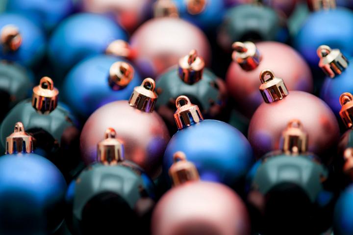 Xmas decorations background with very shallow dof on blue, red and black baubles or balls