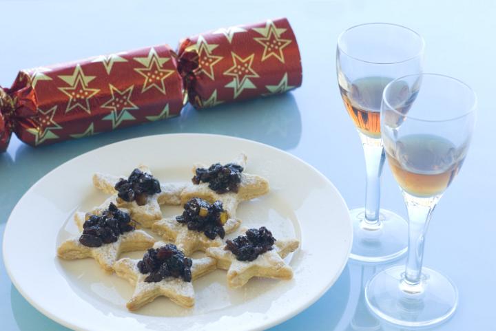 christmas snack appetisers,  mincemeat pastries with glasses of sherry