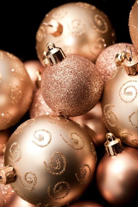 an arrangement of gold coloued glitter decorated sparkly christmas baubles