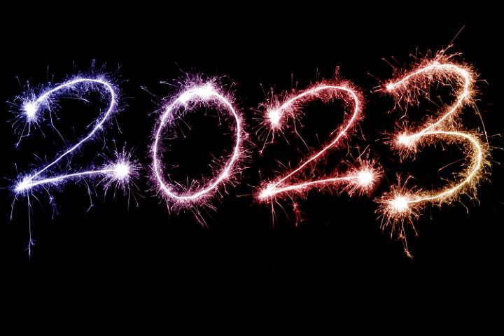 2023 blue and red gradient New Year sparkler background over black with copy space for your holiday greeting
