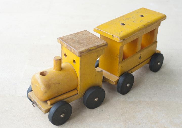 Small wooden toy train ornament to decorate a Christmas arrangement or tree
