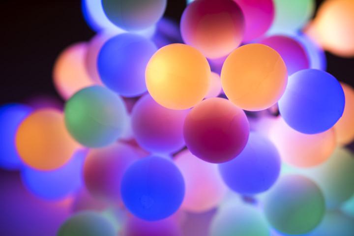 Abstract and defocused background composed of round glowing christmas lights