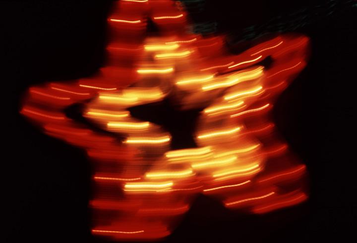 blurred: a red and yellow illuminated christmas star